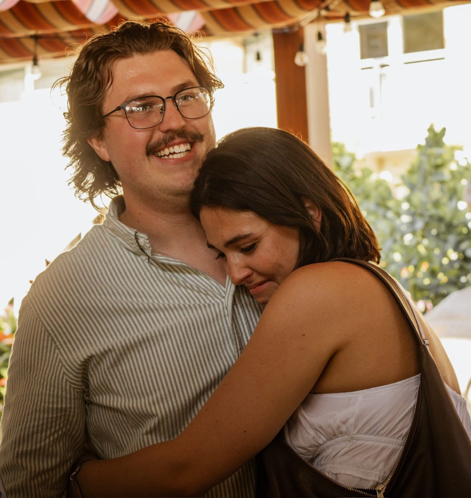 Haley tucked into Slade's chest at golden hour